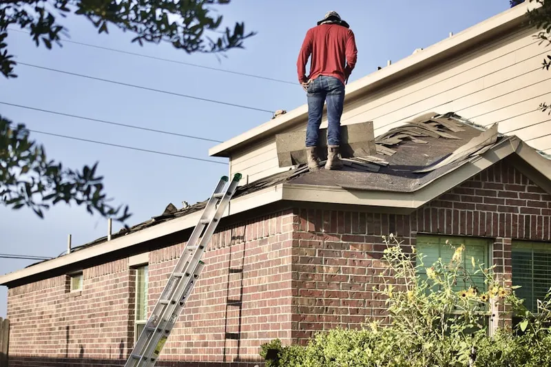 Professional roofer working on a residential roof in Beaufort